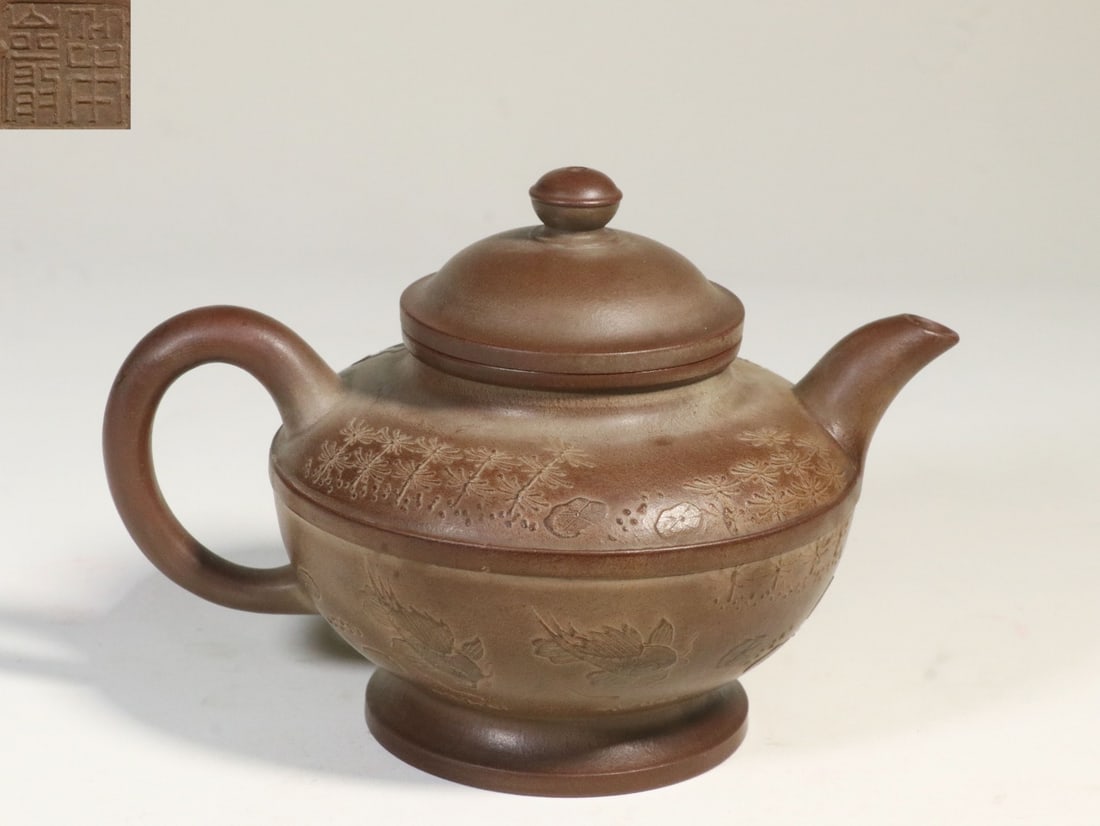 A Zisha Clay Palace-Lantern Teapot: A Zisha Clay Palace-Lantern Teapot. Height: 3.94in Length: 5.98in Diameter: 4.33in Weight: 0.60lbs.