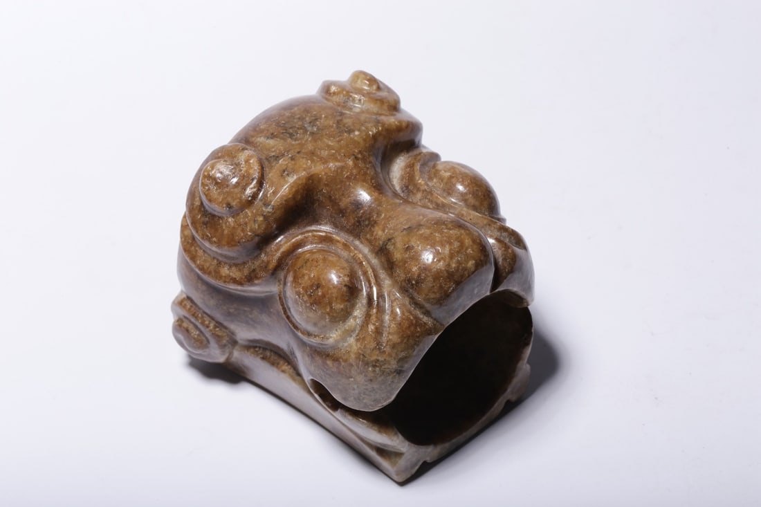 An Ancient Jade Tiger-Head Ring: An Ancient Jade Tiger-Head Ring. Dimensions: 3.15in x 3.54in x 3.15in Weight: 1.56lbs.