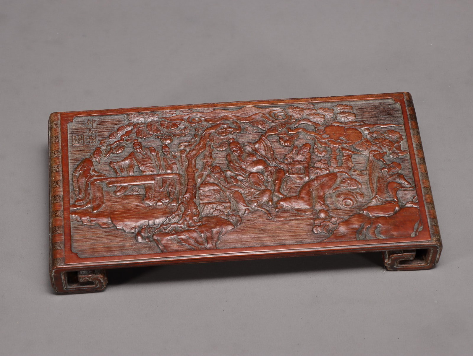A Bamboo Carved Gathering-Under-Pine Inkrest: A Bamboo Carved Gathering-Under-Pine Inkrest. Dimensions: 1.30in x 8.43in x 4.06in Weight: 0.48lbs.