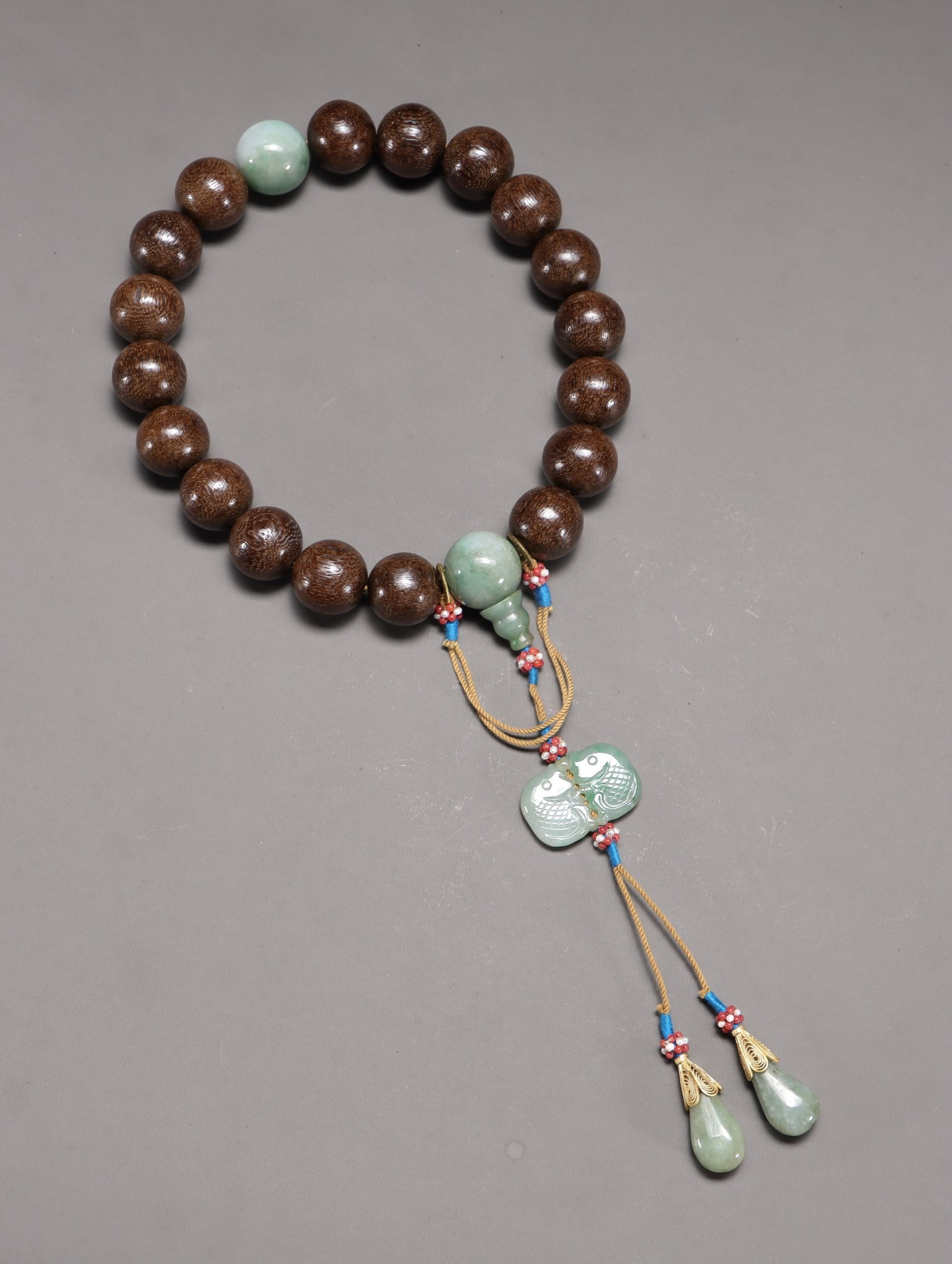 An Agarwood & Jade Prayer Bead Strand: An Agarwood & Jade Prayer Bead Strand. Diameter: 0.79in Weight: 0.29lbs.