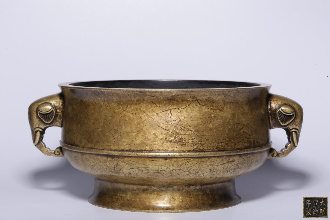 A Bronze Elephant-Ear Censer: A Bronze Elephant-Ear Censer. Dimensions: 5.00in x 11.61in x 9.06in Weight: 12.40lbs.
