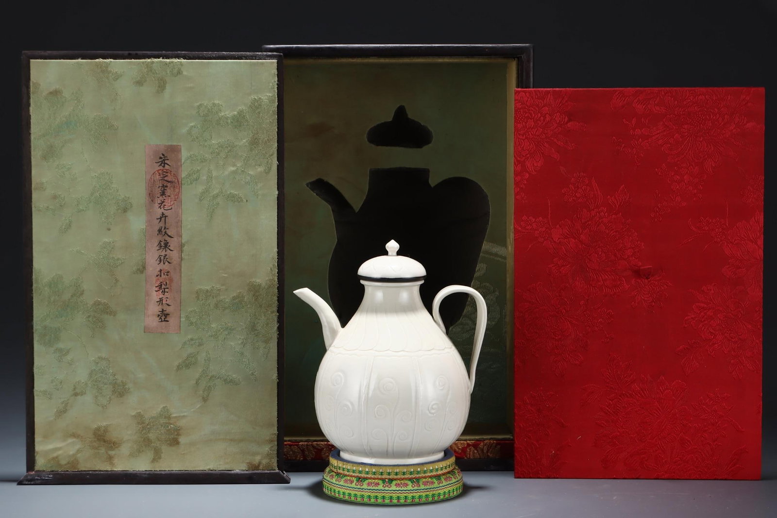 A Ding Ware Pear-Shaped Pot With Silver Mount: A Ding Ware Floral Pear-Shaped Pot With Silver Mount. Dimensions: 7.80in x 6.89in.