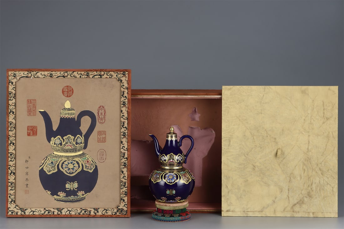 A Porcelain Wine Vessel with Blue Glaze and Floral Gold Decoration: A Porcelain Wine Vessel with Blue Glaze and Floral Gold Decoration. Height: 7.36in; Diameter: 4.53in.
