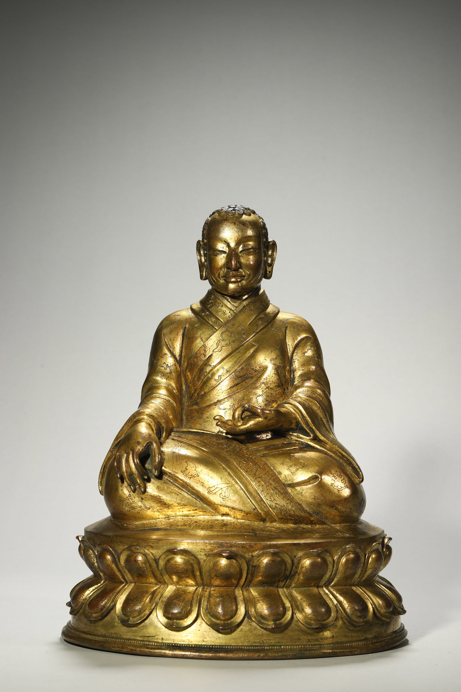 A Gilt-Bronze Court Lama Statue: A Gilt-Bronze Court Lama Statue. Height: 11.81in; Base Width: 9.06in.