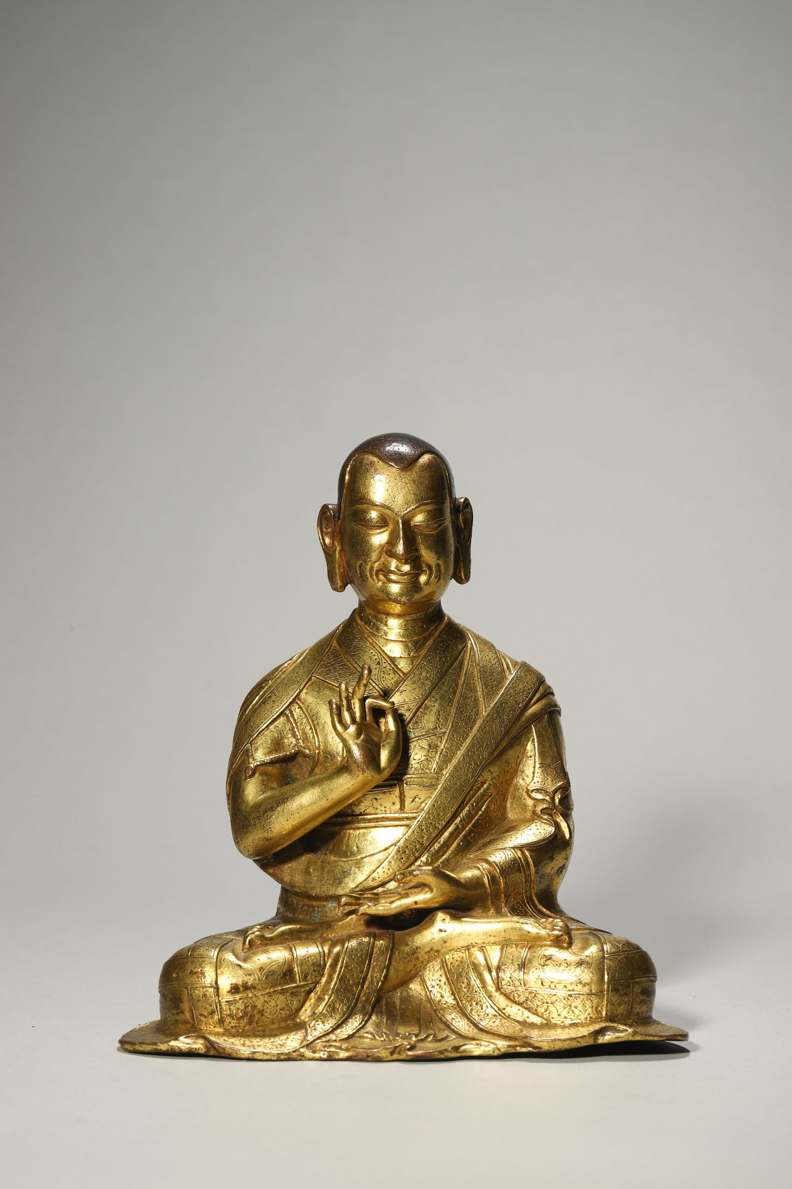 A Gilt-Bronze Lama Statue: A Gilt-Bronze Lama Statue. Height: 6.30in; Base Width: 5.91in.