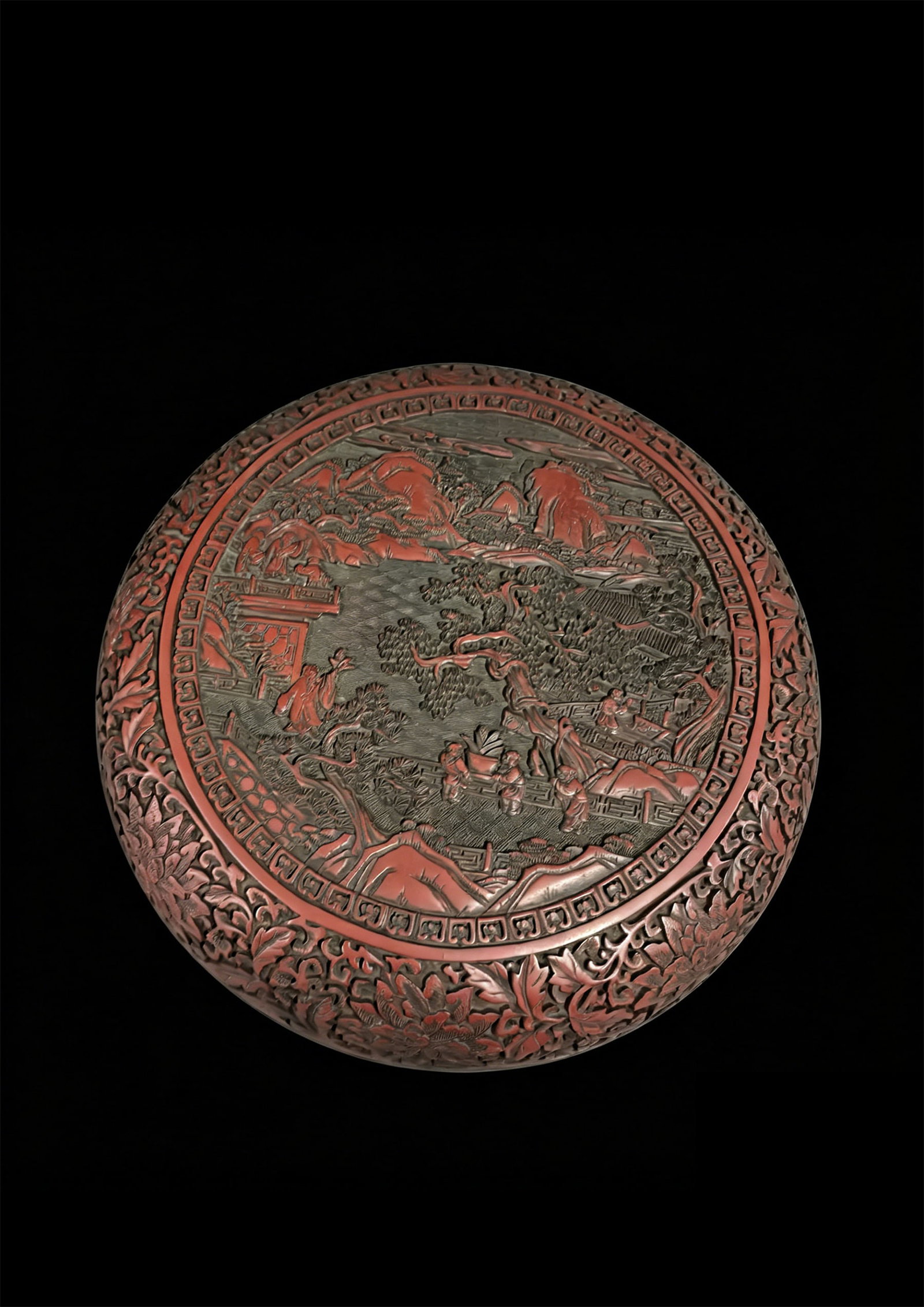 A Carved Red-Lacquer Box Depicting Landscape and Figures: A Carved Red-Lacquer Box Depicting Landscape and Figures. Diameter: 12.60in.