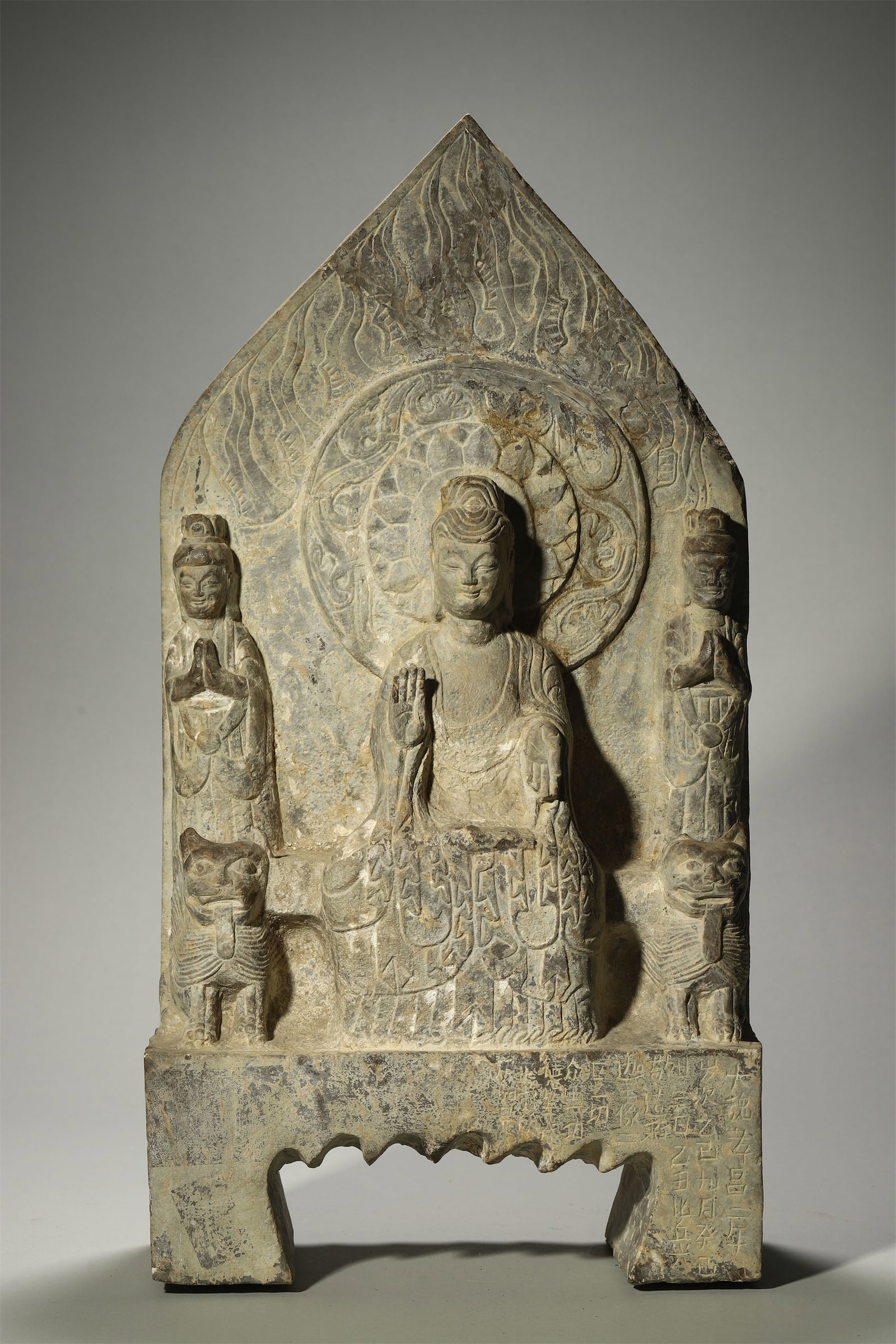 A Stone Stele Depicting One Buddha and Two Disciples with Inscription: A Stone Stele Depicting One Buddha and Two Disciples with Inscription. Height: 21.26in; Width: 11.02in.