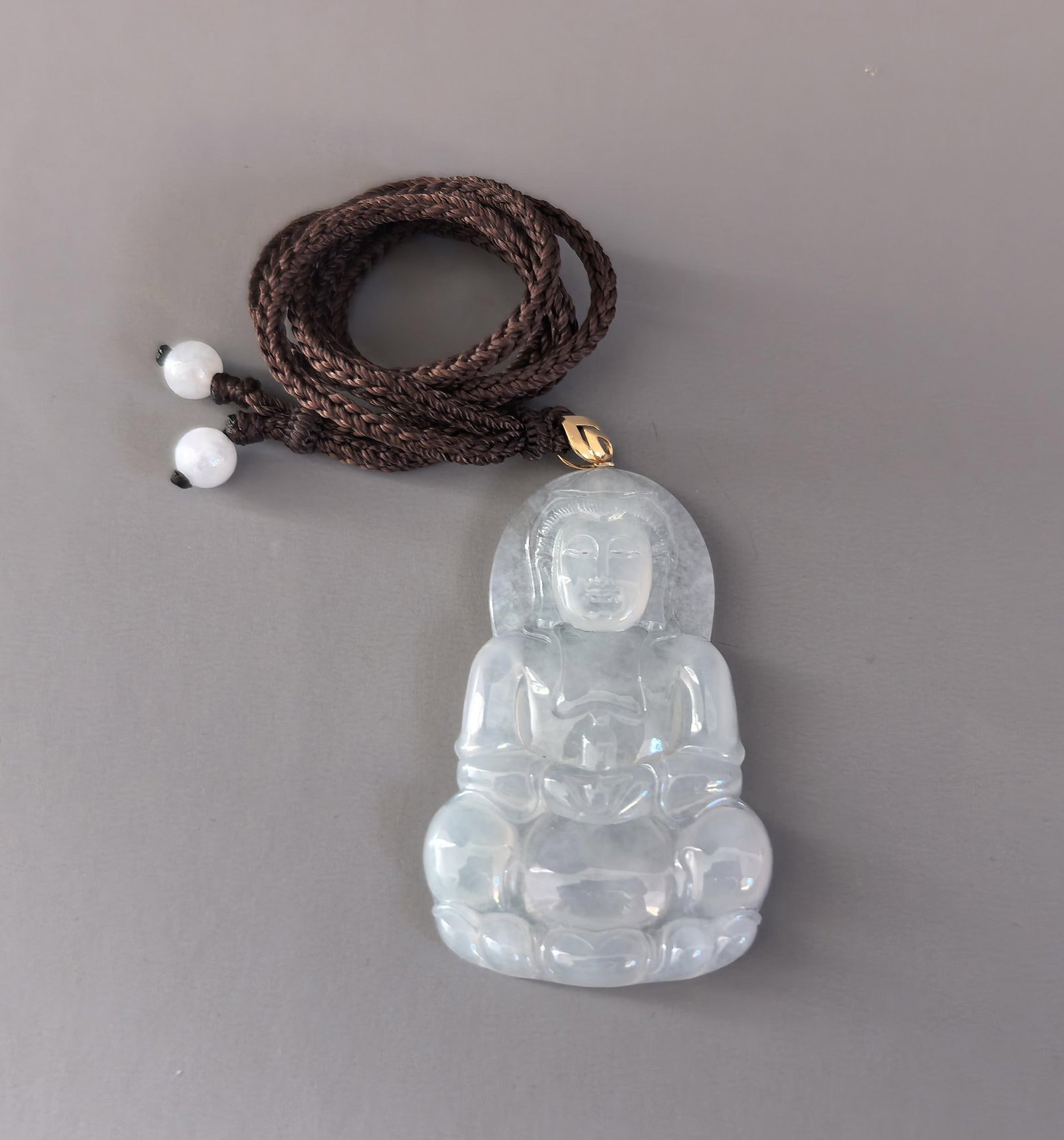A High-Ice Jadeite Pendant Depicting Guanyin: A High-Ice Jadeite Pendant Depicting Guanyin. Height: 2.52in; Weight: 0.05lb.