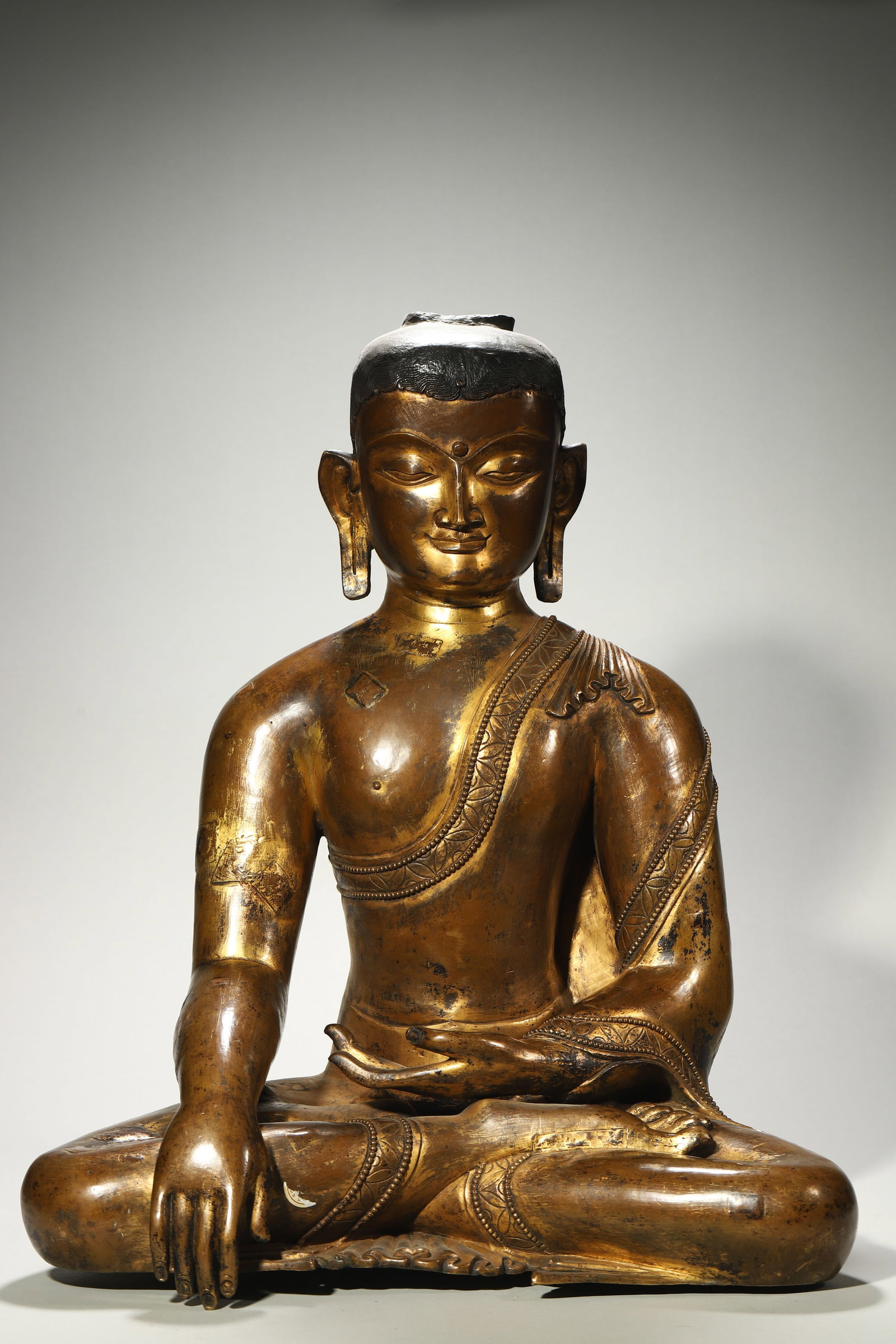 A Bronze Court Statue of Shakyamuni: A Bronze Court Statue of Shakyamuni. Height: 21.65in; Base Height: 18.50in.