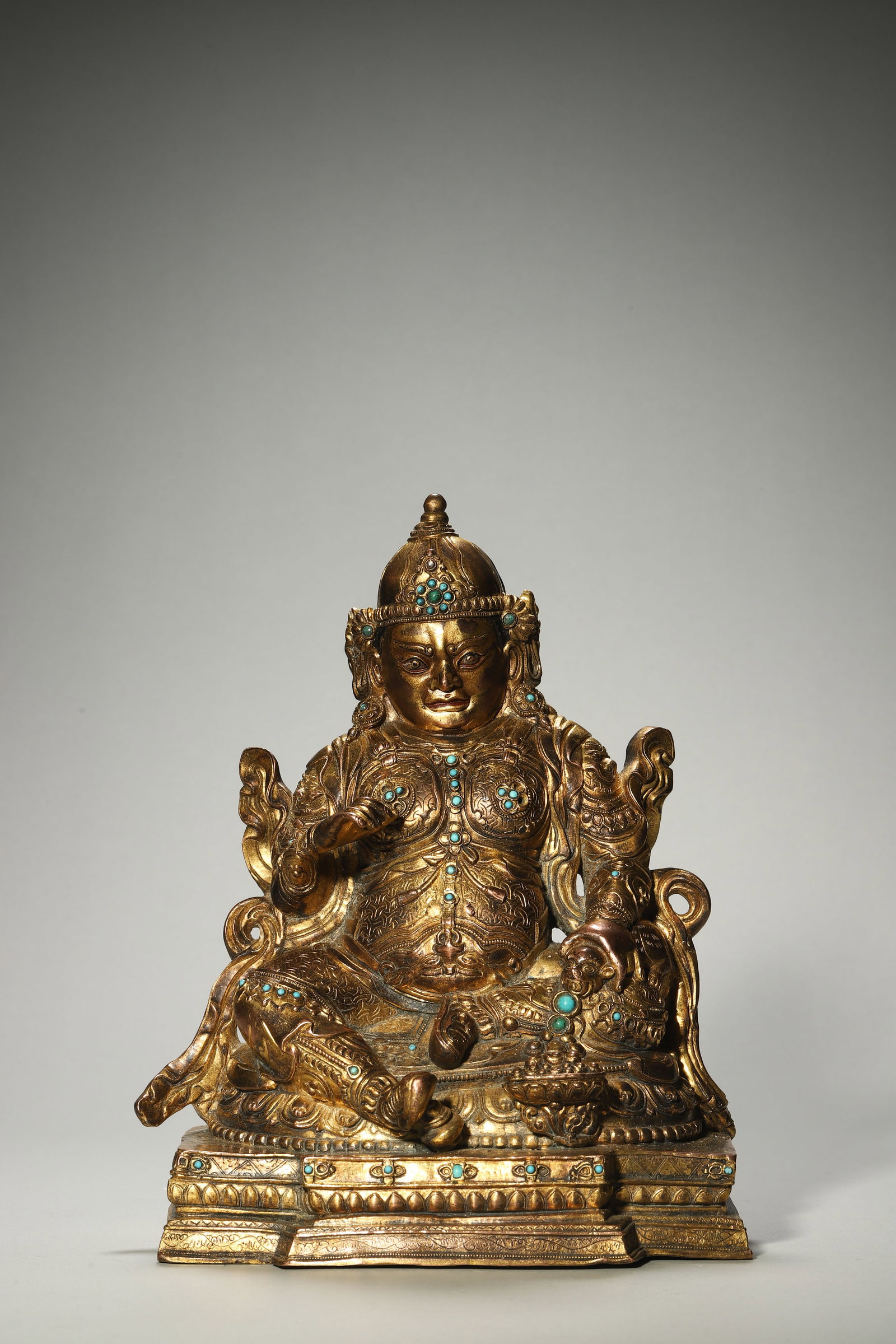 A Gilt-Bronze Treasure-Inlaid Wealth Deity Statue: A Gilt-Bronze Treasure-Inlaid Wealth Deity Statue. Height: 9.84in; Base Length: 7.68in; Width: 5.98in.