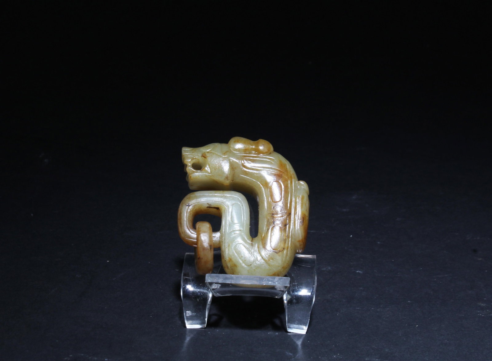 A Jade Ornament: A Jade Ornament. Dimensions: 1.75" x 1.5".