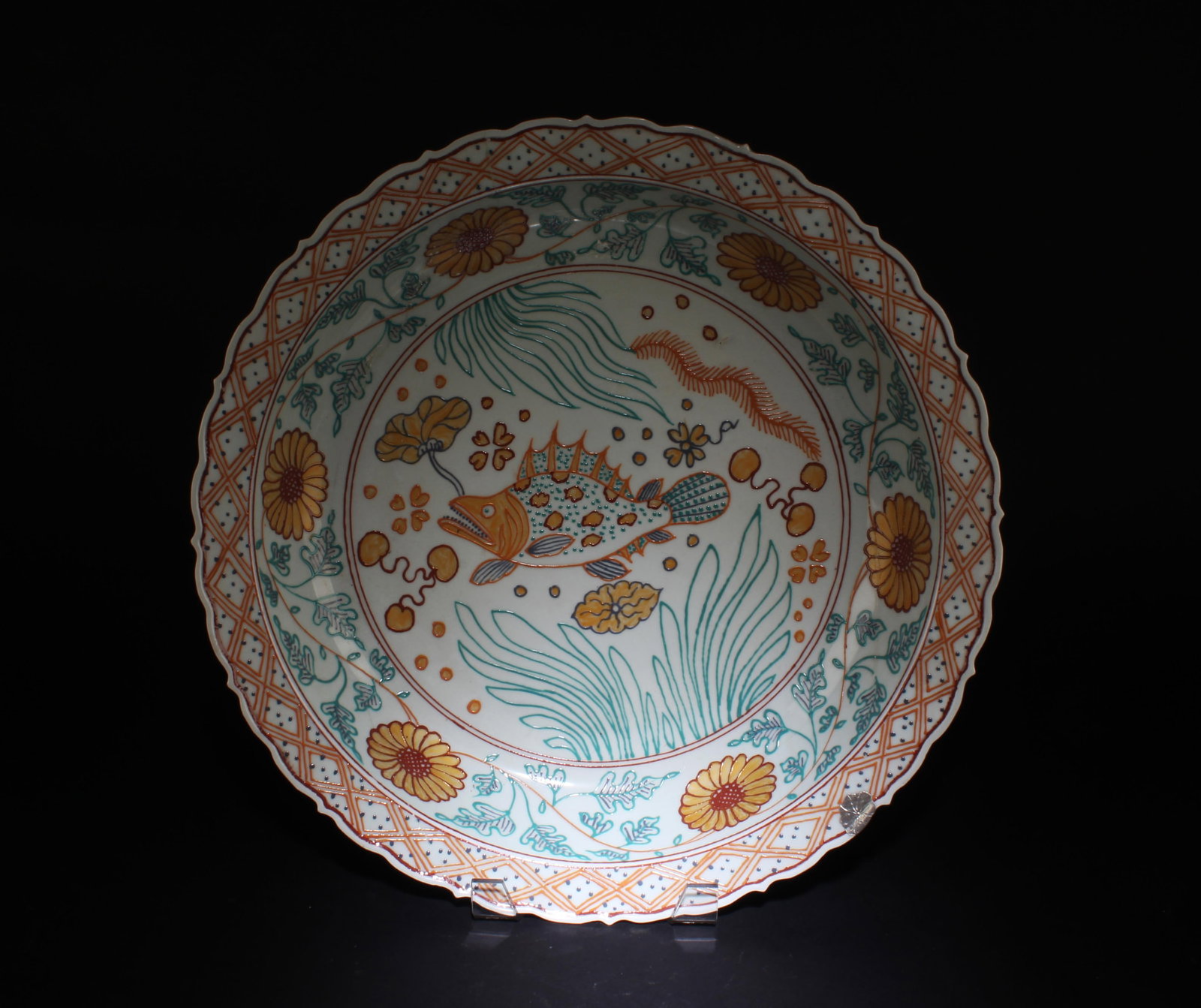 A Porcelain Multi-Colored Charger: A Porcelain Multi-Colored Charger. Dimensions: 17.7" x 3".