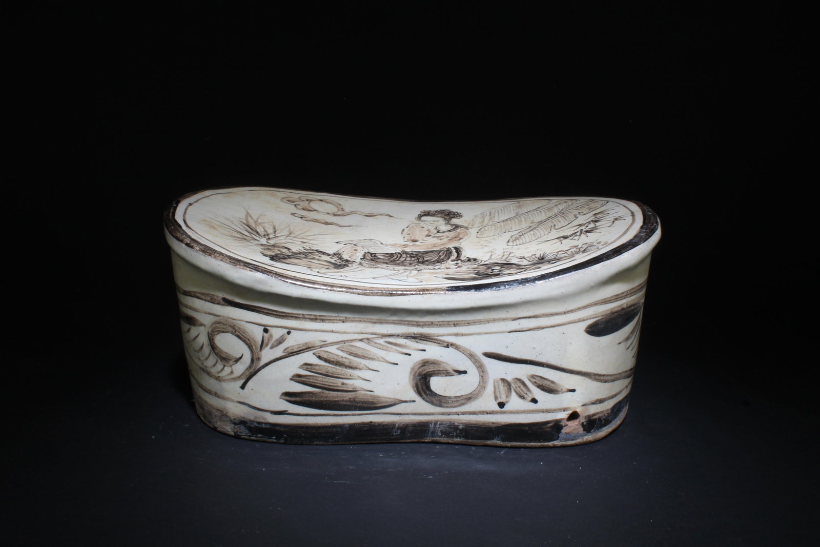 A Cizhou Pillow: A Cizhou Pillow. Dimensions: 11.5" x 7.75" x 5".
