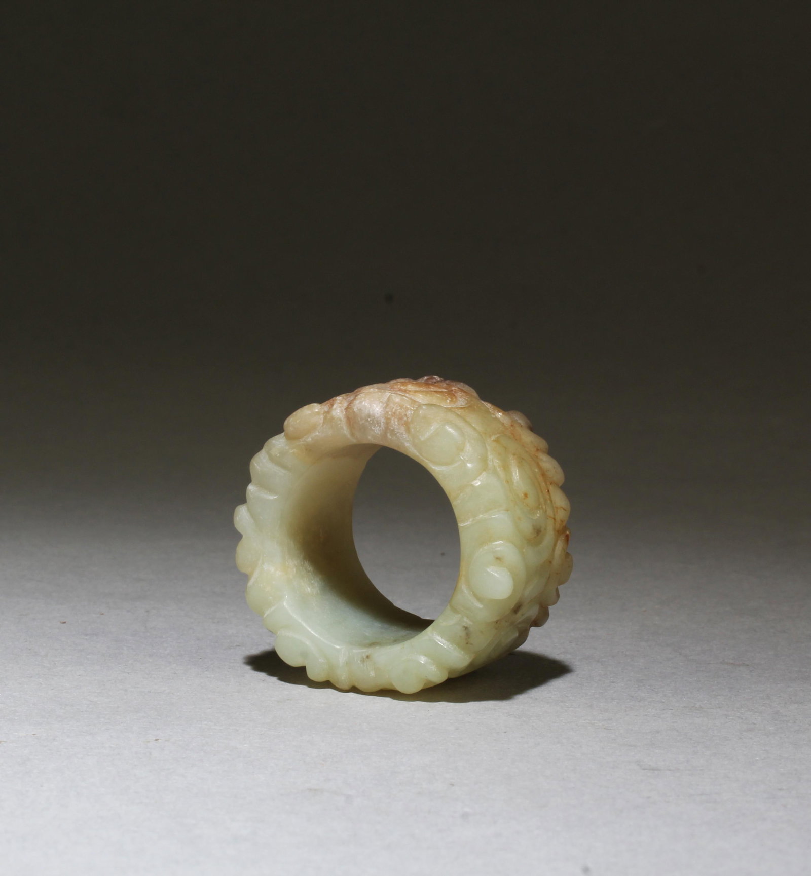 An Old Carved Jade Archer's Ring: An Old Carved Jade Archer's Ring. Outer Diameter: 1.25" Inner Diameter: 0.8"