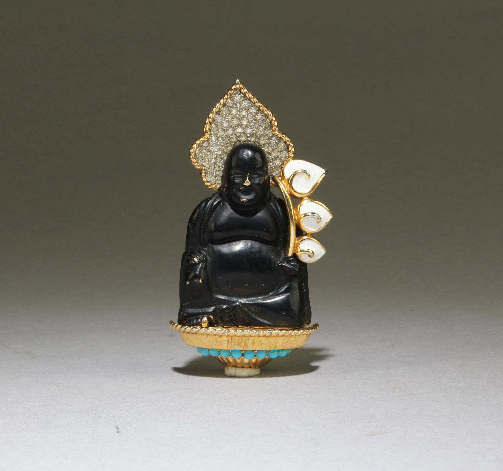 A Gilt Bronze 'Buddha Statue' Brooch: A Gilt Bronze 'Buddha Statue' brooch, with turquoise inlay. Height: 3"