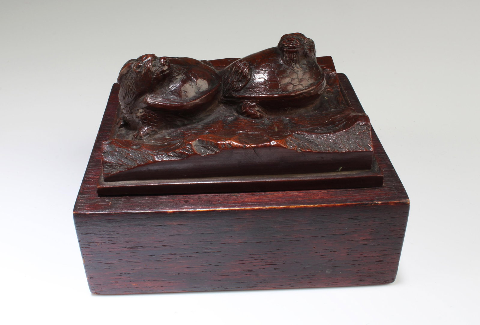 A Wooden Decorative Ornament: A Wooden Decorative Ornament. Length: 4.25" Width: 3.85" Height: 2.75"
