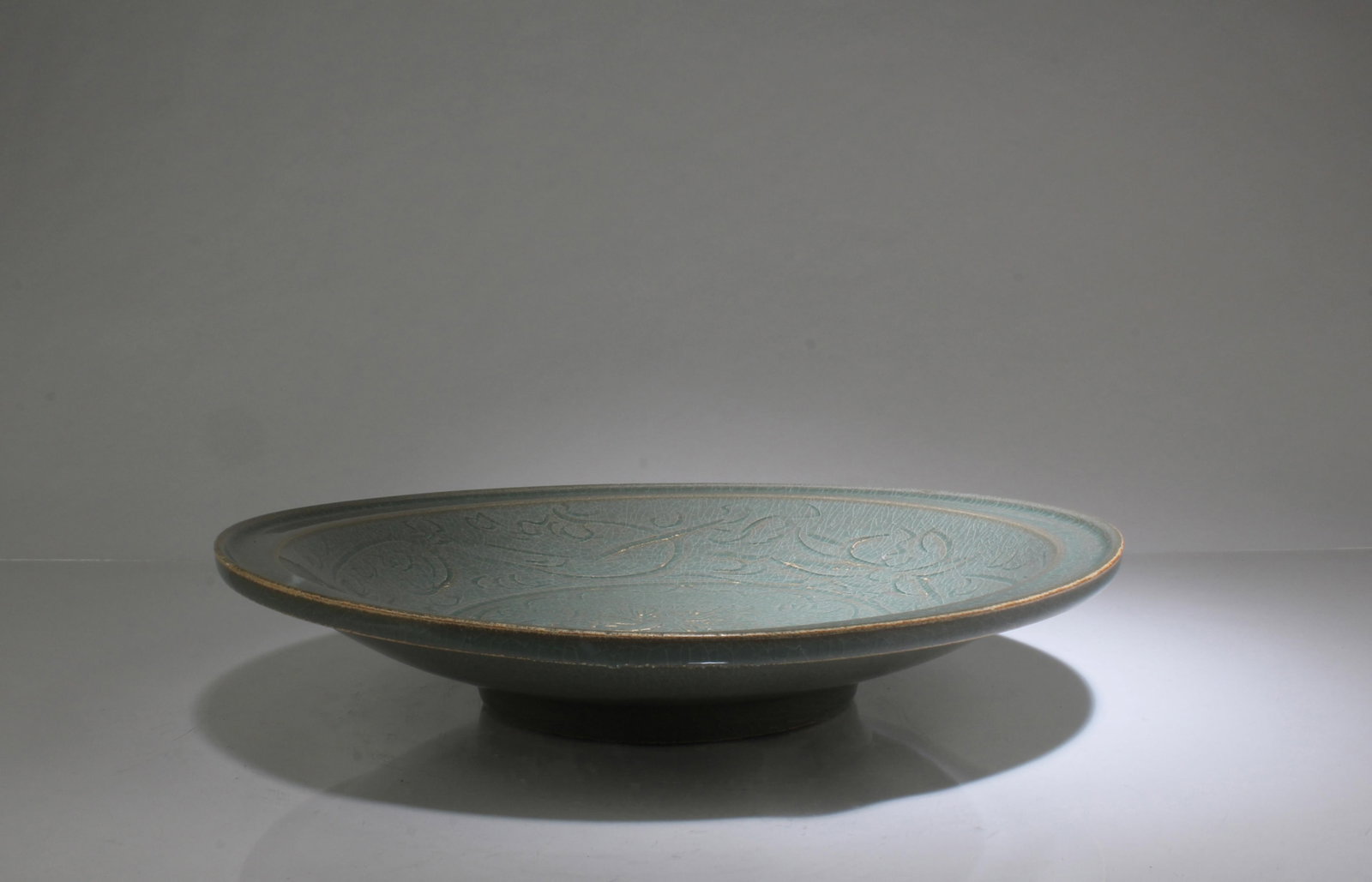 A Celadon Plate: A Celadon Plate. Diameter: 12"