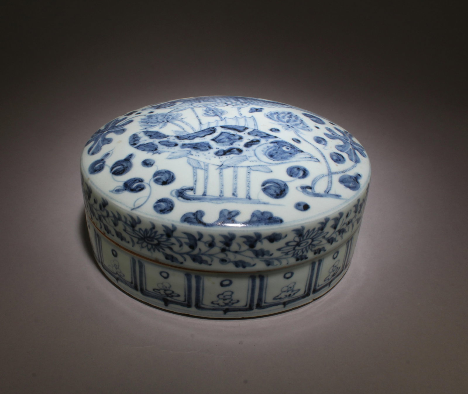 A Blue & White Round Container: A Blue & White Round Container. Diameter: 8.5" Height: 3.5"