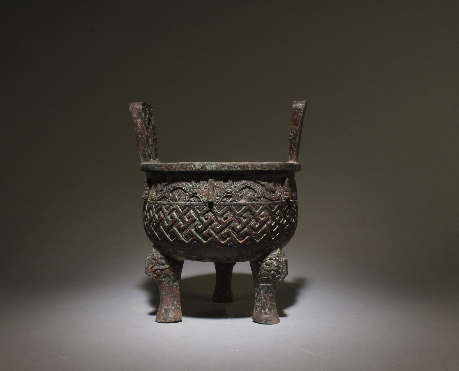 Chinese Bronze Tripod Censer: Chinese Bronze Tripod Censer, flanked by twin handles. Diameter: 7.25"