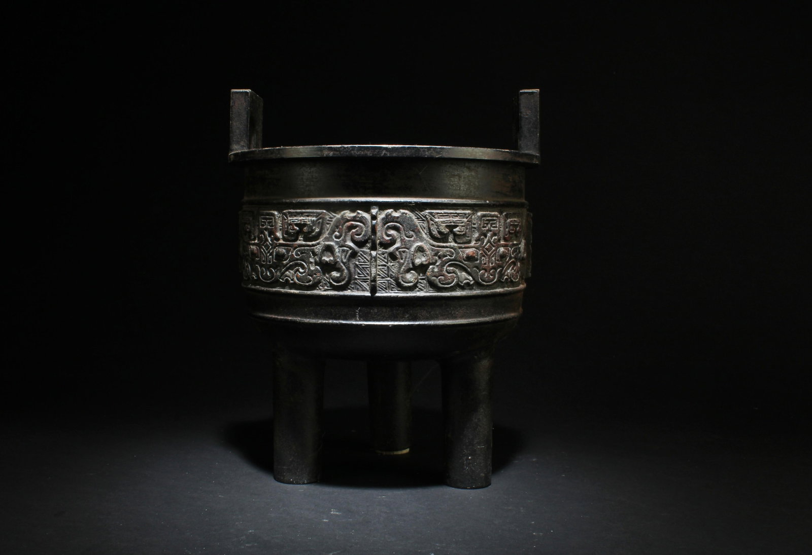 A Bronze Tripod Censer: A Bronze Tripod Censer. Height: 10.5"
