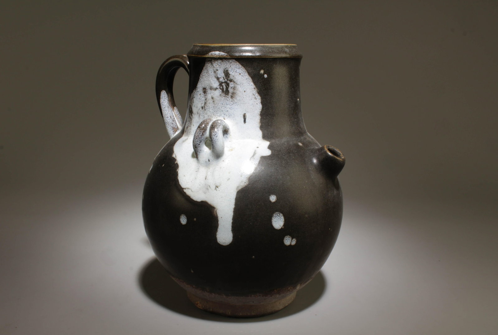 A Pottery Pot: A Pottery Pot. Dimension: 7" x 8.75".