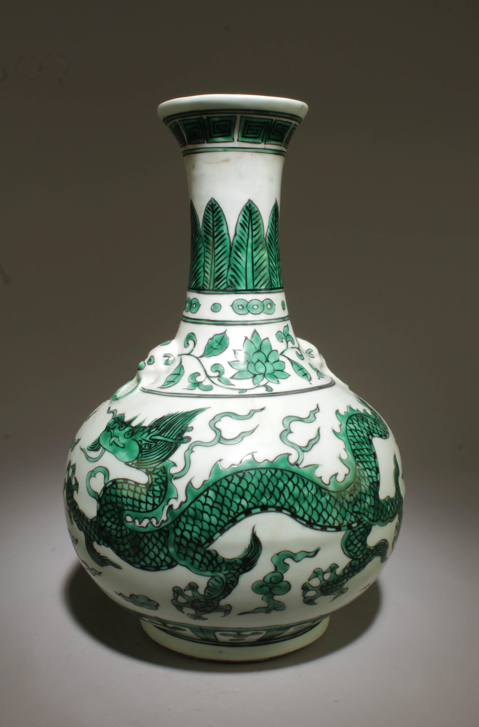 A Green and White Dragon Vase: A Green and White Dragon Vase. Dimension: 8" x 12".