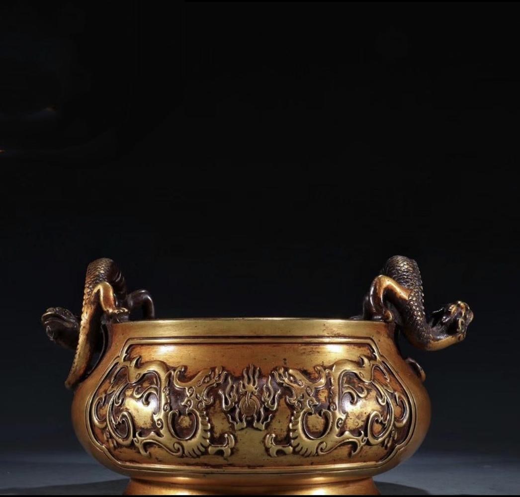 A Gilt Bronze Incense Burner: A Gilt Bronze Incense Burner. 'QianLong' mark at base. Diameter: 8" Height: 4.3" Weight: 6.9lb