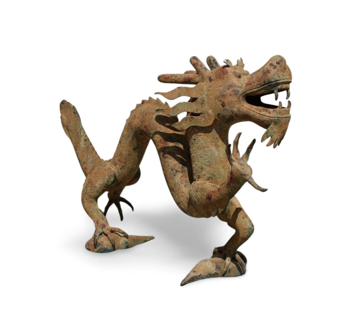 A Bronze Dragon Statue: A Bronze Dragon Statue. Dimension: 38.5" x 9.5" x 10.5".