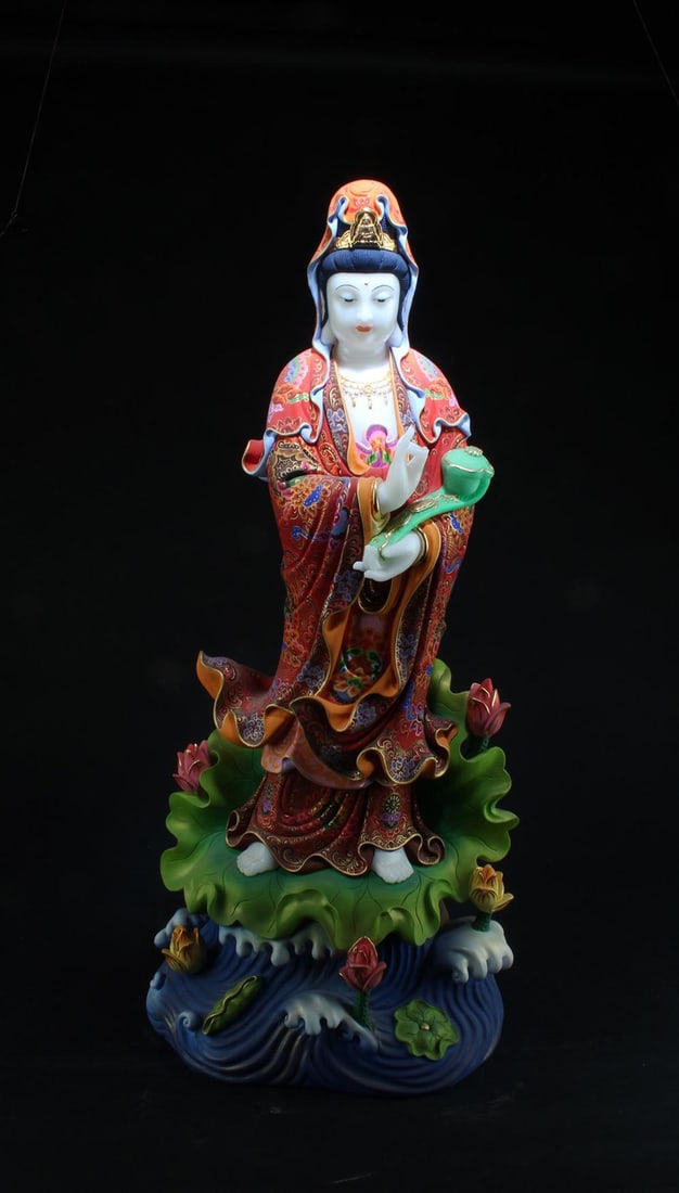 A Carved Jadestone Guanyin Statue: A Carved Jadestone Guanyin Statue. Height: 26.5"