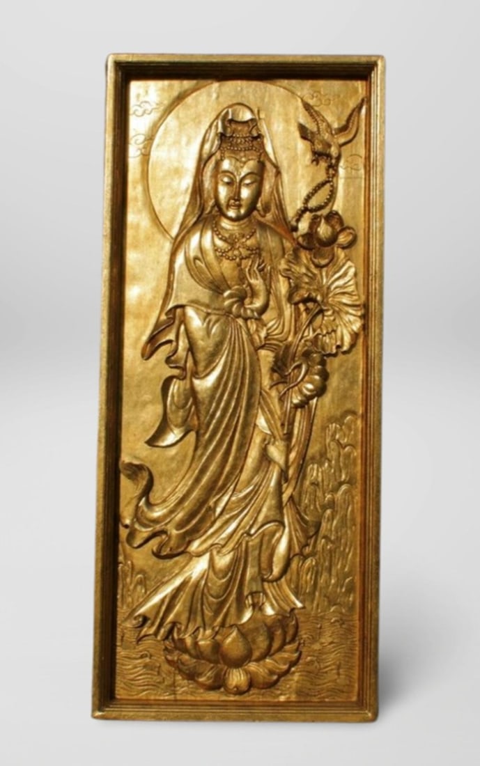 A Large Gold Leaf Paste Wooden Guanyin Plaque: A Large Gold Leaf Paste Wooden Guanyin Plaque. Dimension: 26" x 61.5" x 2.75".
