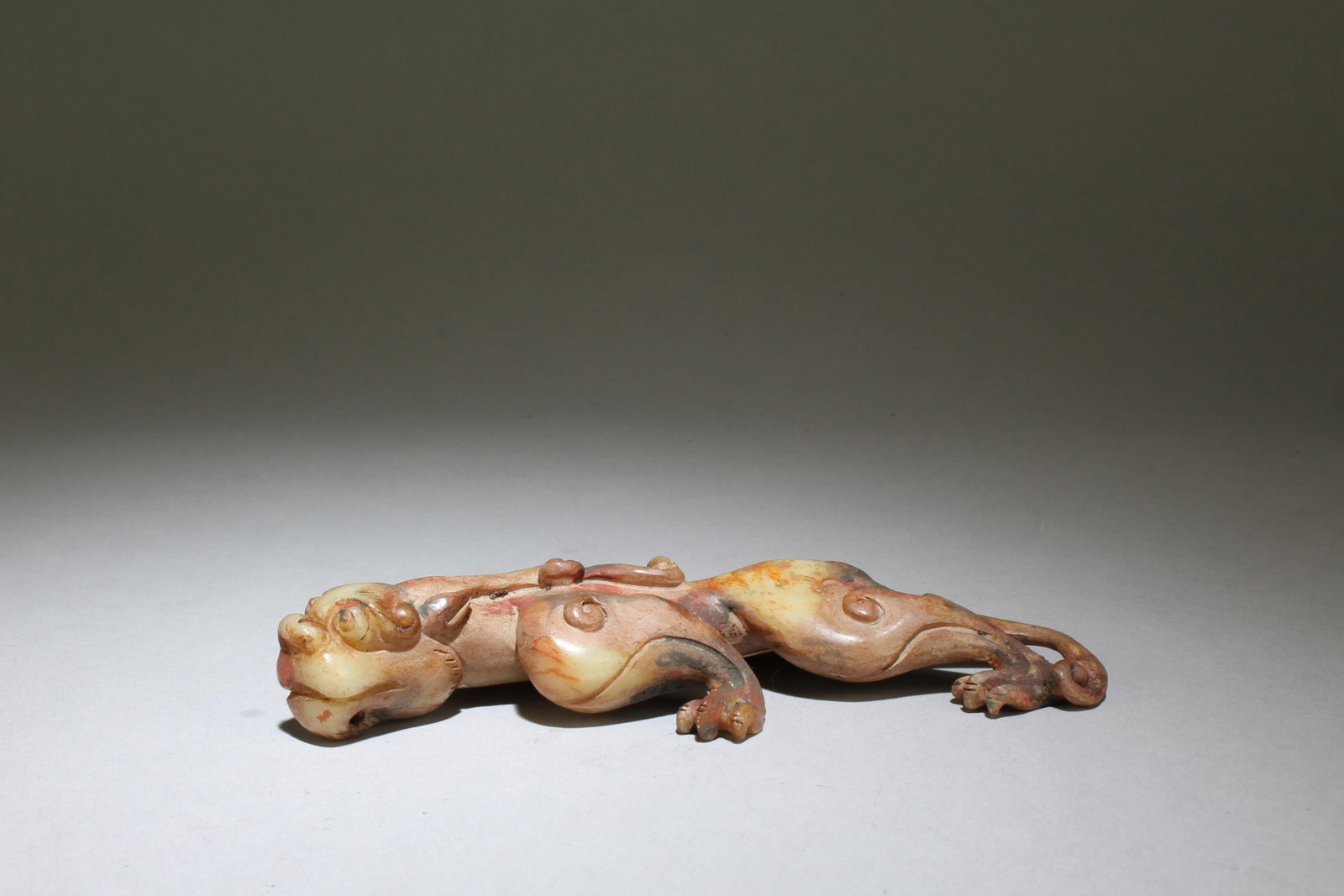 A Jade Mythical Beast Figurine: A Jade Mythical Beast Figurine. Dimensions: 6.2" x 3.5".