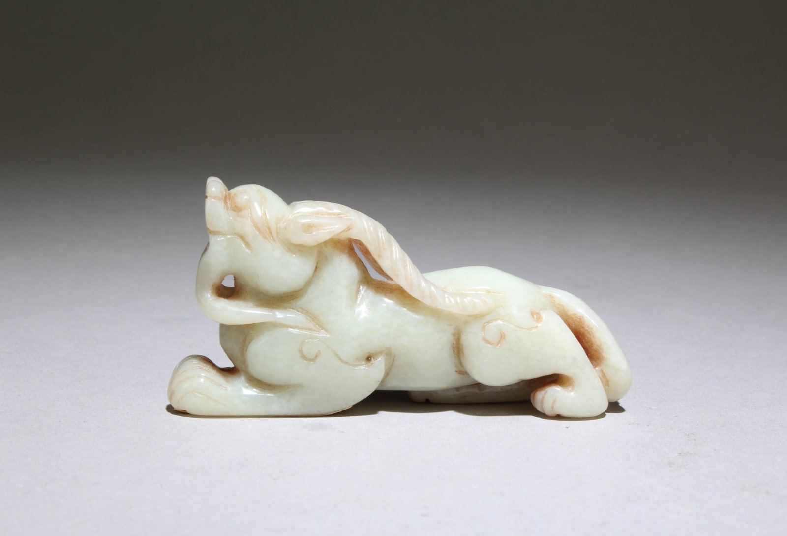 A Jade Mythical Beast Figurine: A Jade Mythical Beast Figurine. Dimensions: 3" x 1.5".