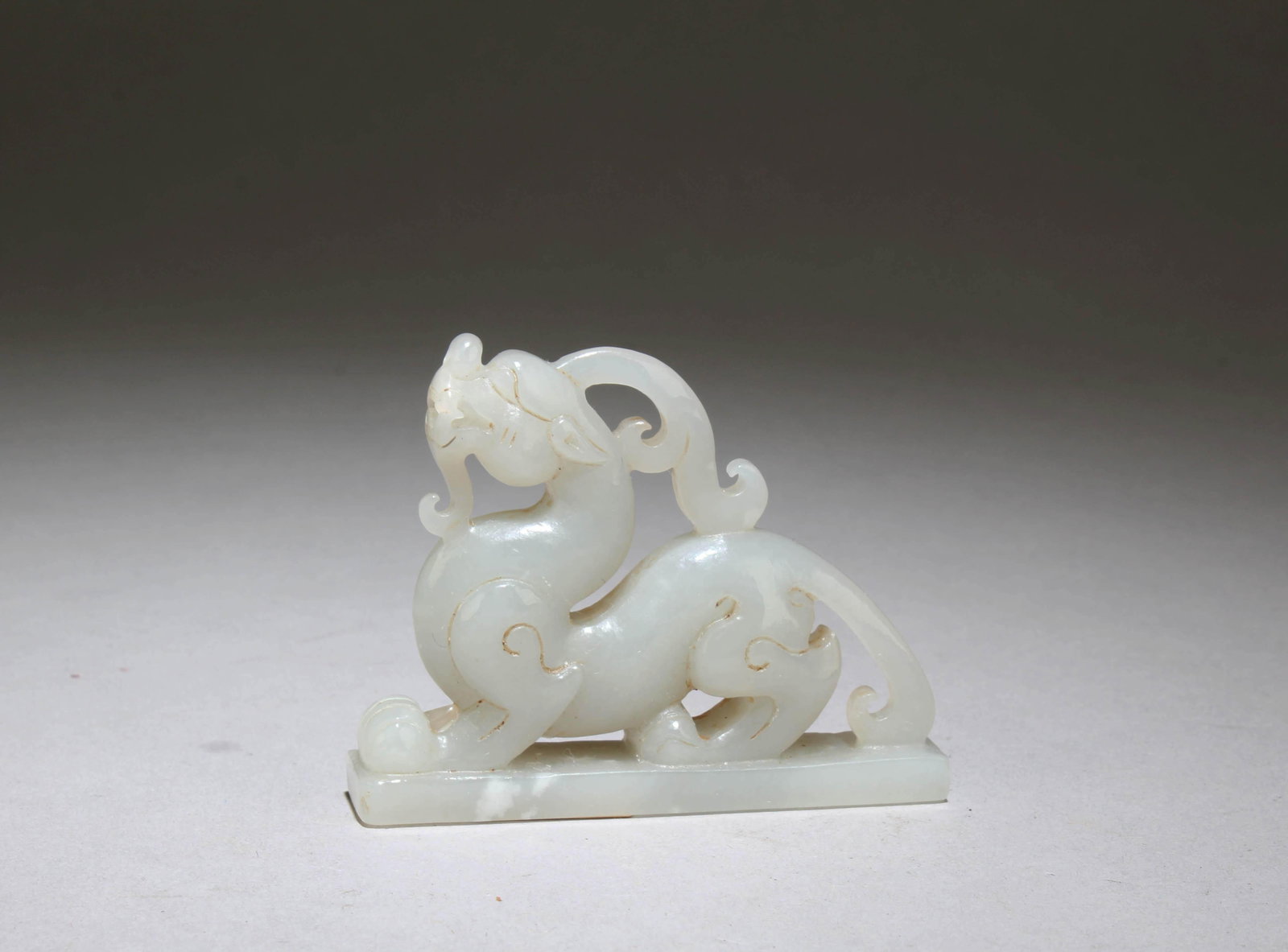 A Jade Mythical Beast Figurine: A Jade Mythical Beast Figurine. Dimensions: 2.75" x 2.2".