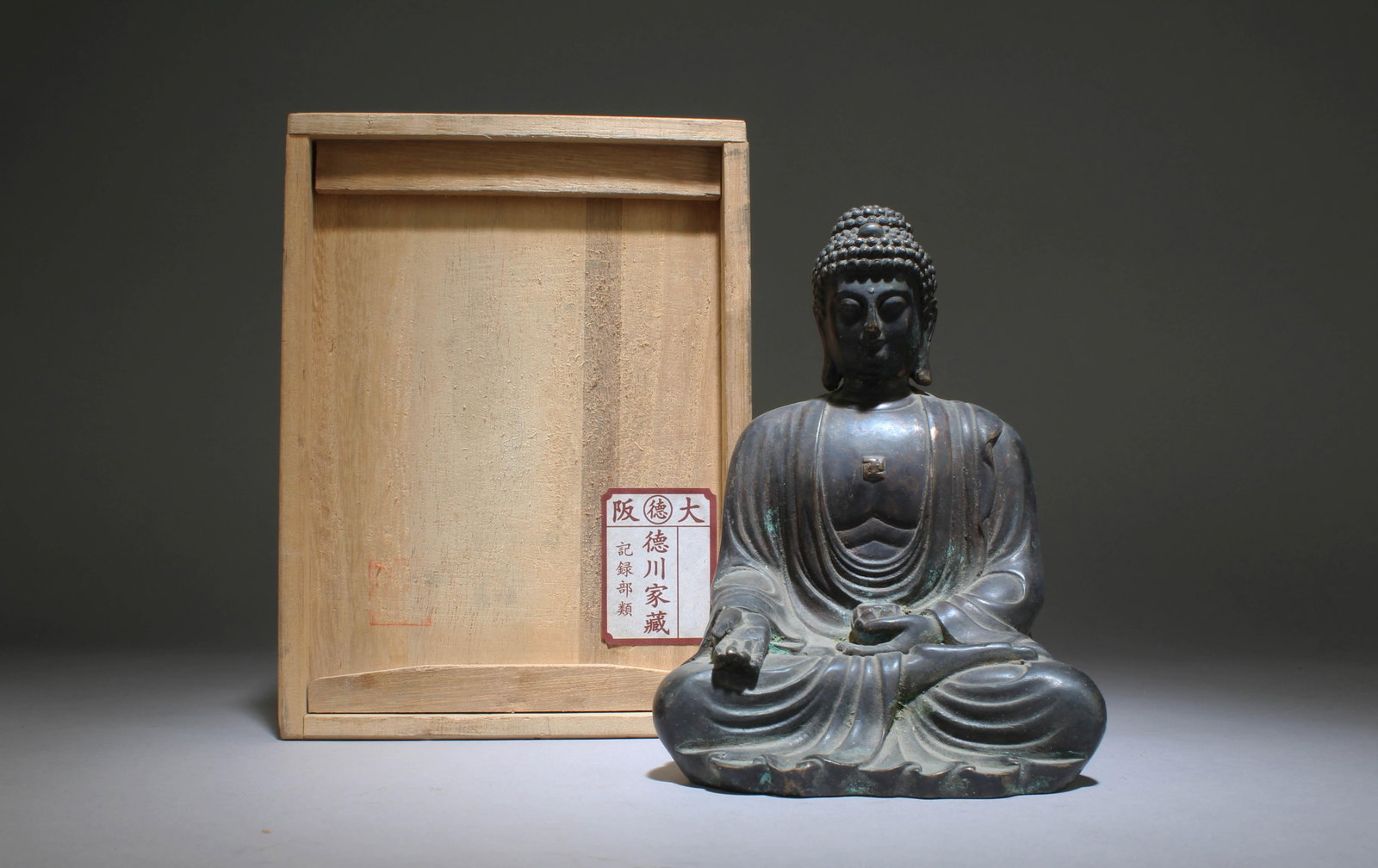 A Bronze Buddha Statue: A Bronze Buddha Statue. Dimensions: 6" x 4.5".