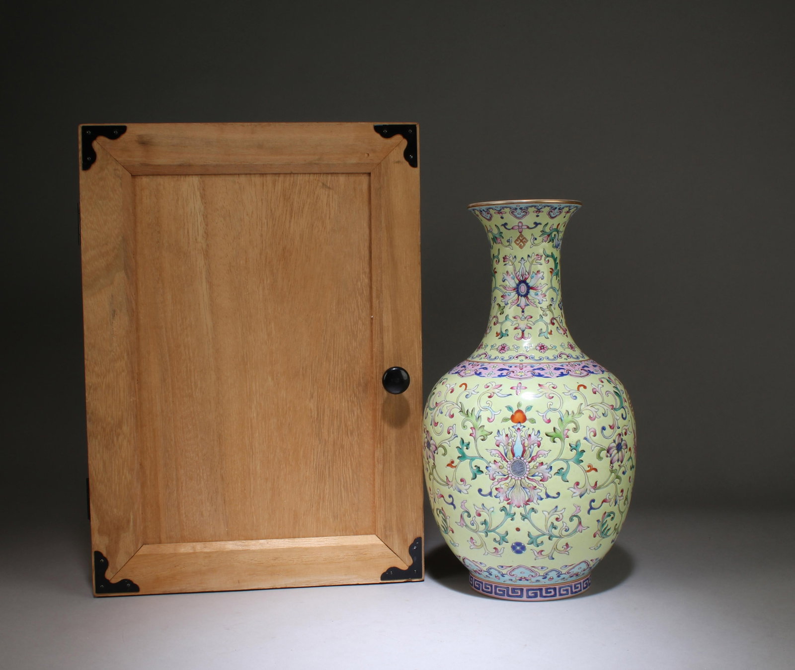 A Fencai Ceramic Vase with Box: A Fencai Ceramic Vase with Box. "QianLong" mark at base. Dimensions: 11.5" x 6.3"
