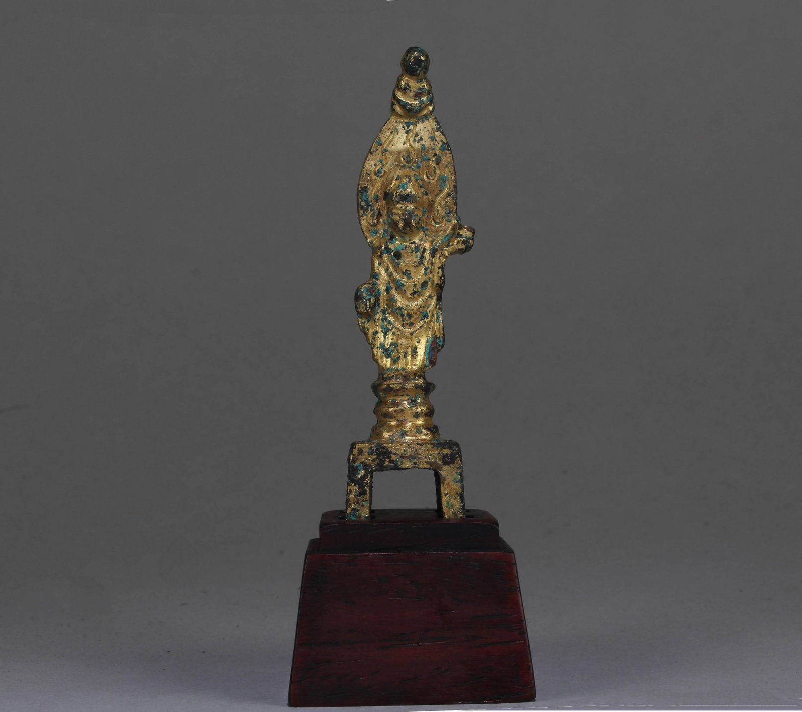 A Chinese Gilt Bronze Buddha: A Chinese Gilt Bronze Buddha. Dimension: 3.5" x 1" x 0.75". Dimension with Stand: 4.5" x 1.75" x 1.6".