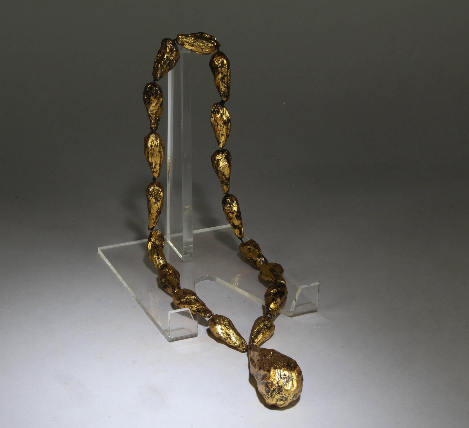 A Gold Pasted Agarwood Necklace: Dimension: Connected Top to Bottom Height: 18.5".