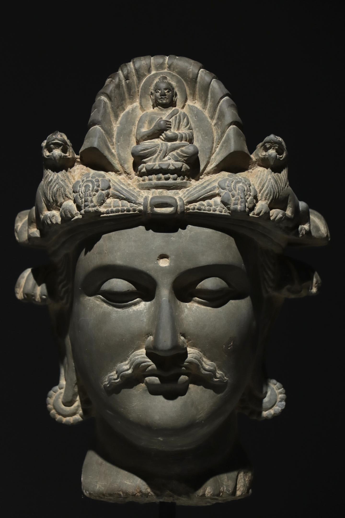 3RD CENTURY GANDHARA ART: 3RD CENTURY GANDHARA ART. Height:53cm Height:30cm Grey stone Gandhara Buddhist deity head, blending Greco-Buddhist carving style, with crown carved Buddha and lions, classic ancient Central Asian