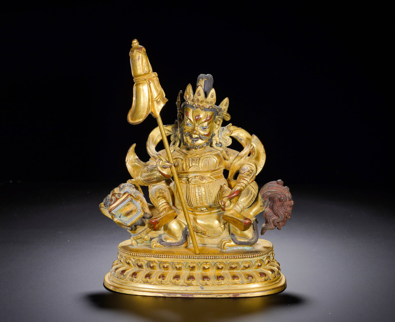 A GILDED BRONZE STATUE OF KING OF TREASURES FROM THE QING DYNASTY: A GILDED BRONZE STATUE OF KING OF TREASURES FROM THE QING DYNASTY. Height:20cm(7.87in), Width:17cm(6.69in), Weight:1980g (4.366lb)Cast gilt bronze figure of Vaishravana, one of the most important weal