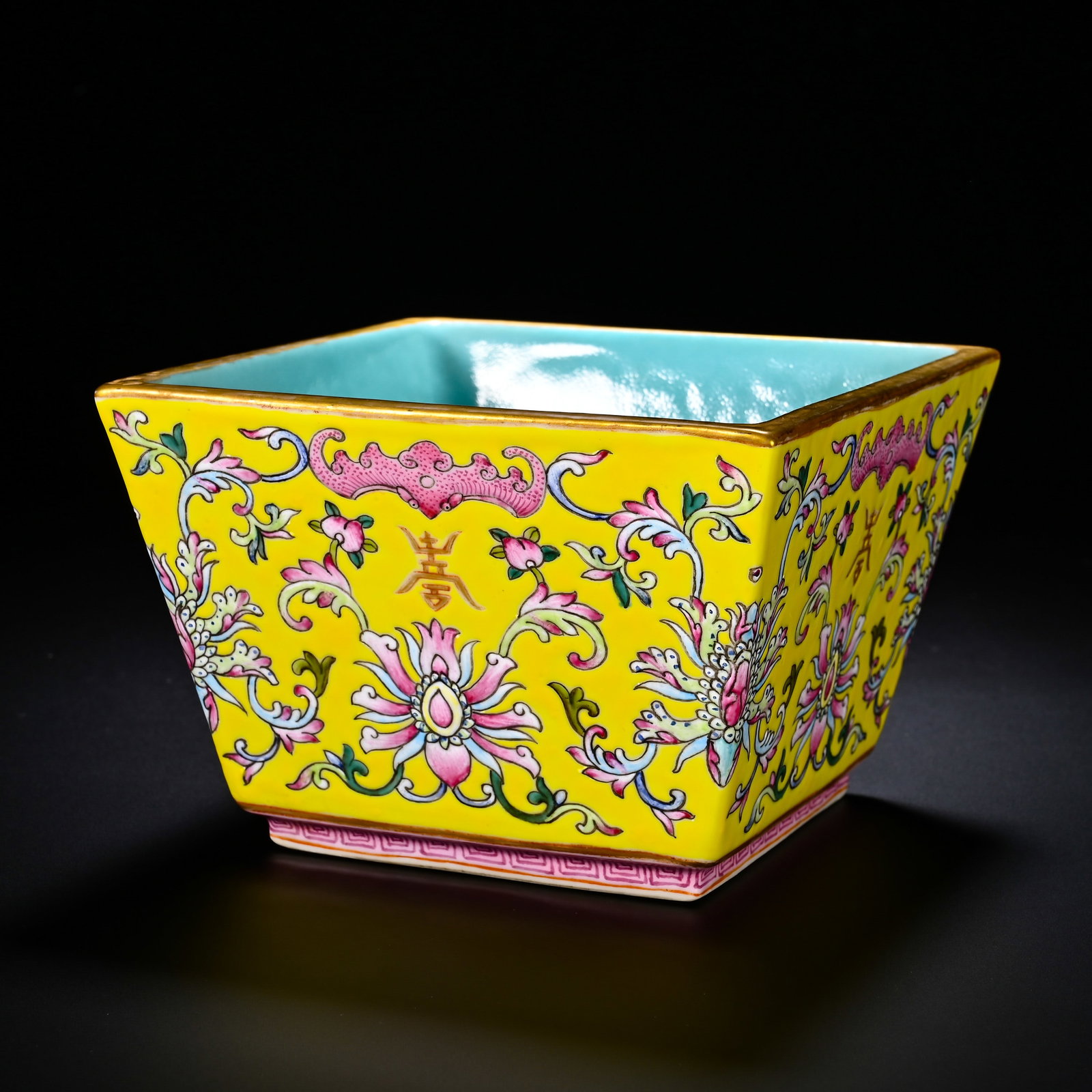 QING QIANLONG YELLOW GROUND POLYCHROME FOUR-SIDED BUCKET CUP WITH LOTUS AND BAT LONGEVITY PATTERNS