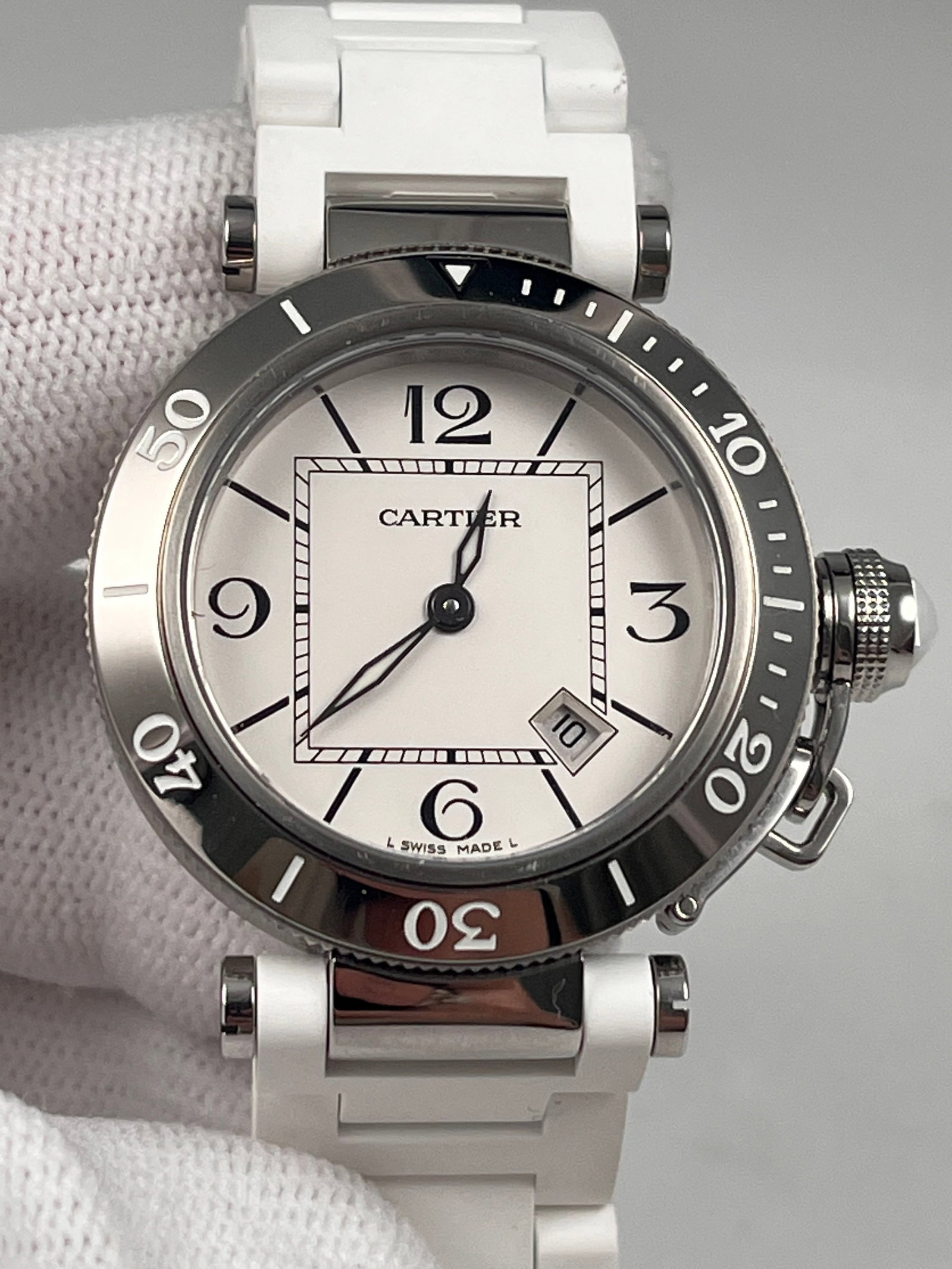 CARTIER PASHA LADIES' WATCH: CARTIER PASHA LADIES' WATCH. 33mm stainless steel case, unused 9.99 new, white rubber strap, sapphire crystal glass, quartz movement with date display