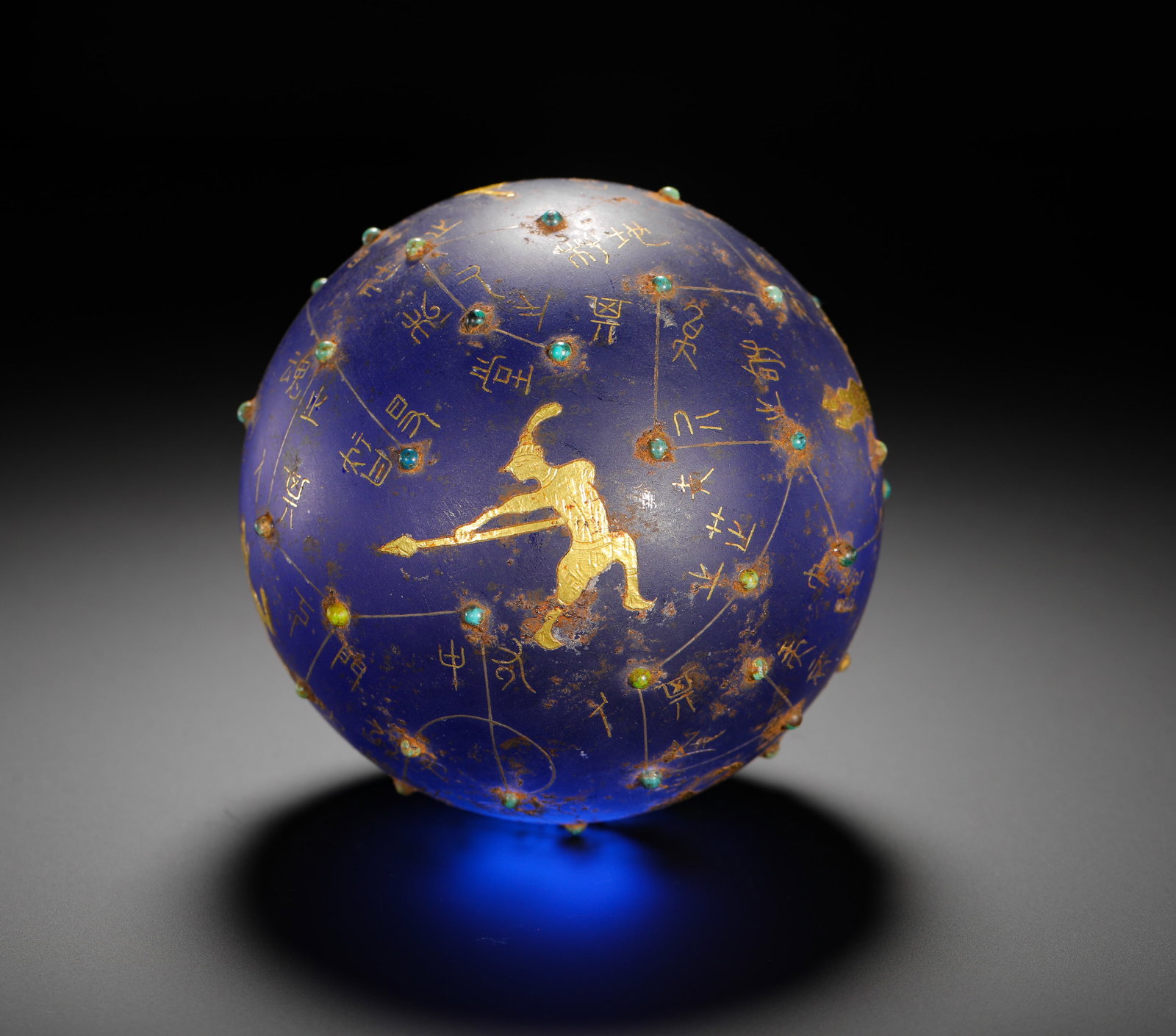 HAN DYNASTY GLASSWARE WITH GOLD INLAID TURQUOISE ASTRONOMICAL STAR SPHERE: HAN DYNASTY GLASSWARE WITH GOLD INLAID TURQUOISE ASTRONOMICAL STAR SPHERE. D:10cm(3.94in) Weight:1230g(2.71lb)Han Dynasty deep blue glass celestial sphere inlaid with gold and turquoise. The