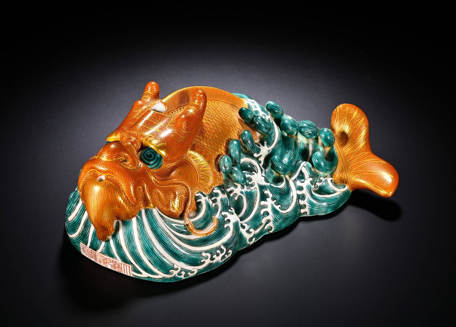 QING DYNASTY QIANLONG ALUM RED GILDED FISH DRAGON WATER BASIN: QING DYNASTY QIANLONG ALUM RED GILDED FISH DRAGON WATER BASIN. Height:7.5cm(2.95in), Width:17cm(6.69in)Finely modelled in three-dimension as a dragon-carp amid surging waves. The dragon-head and fish-