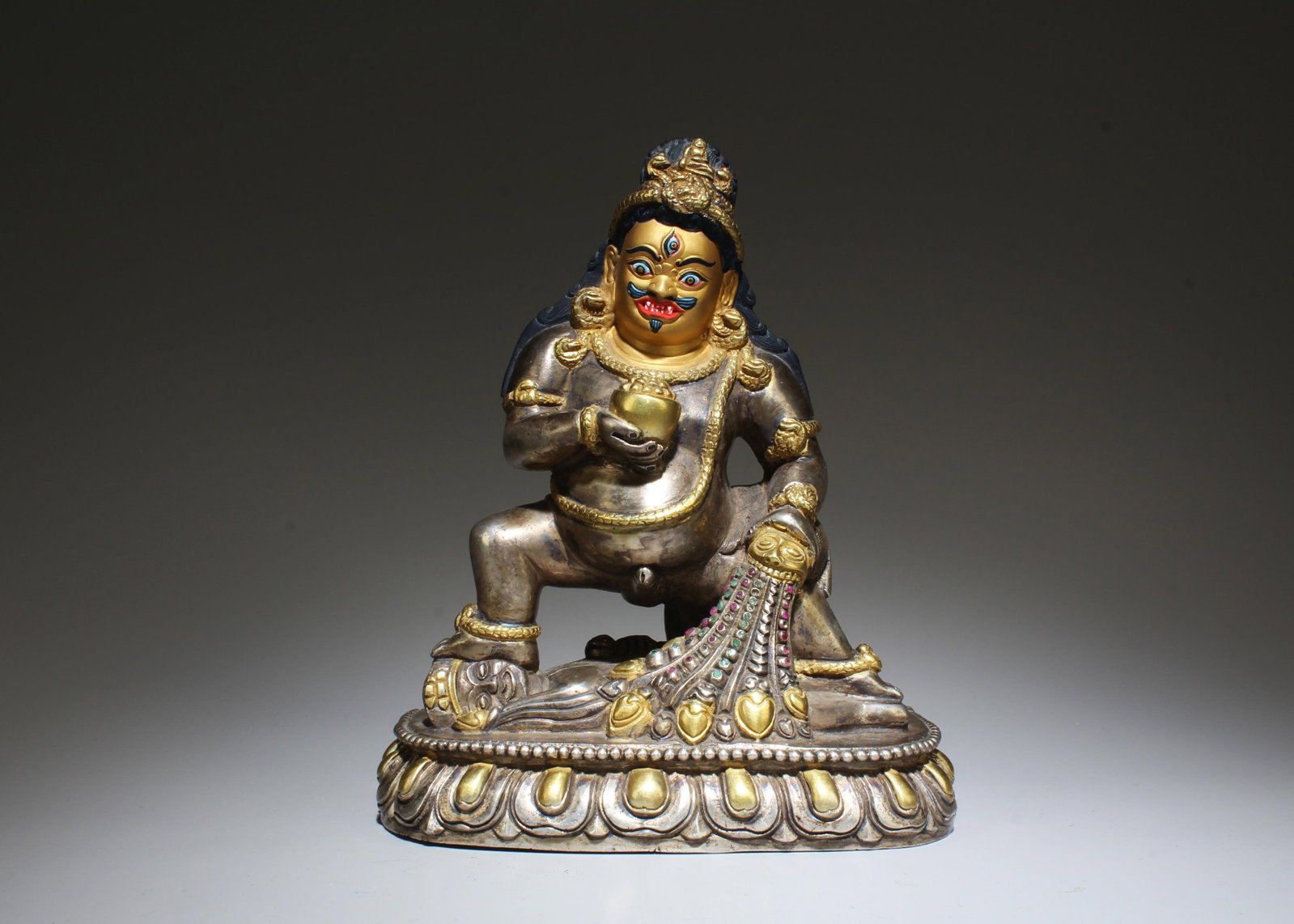 A Masterpiece Pure Silver Standing Jambalaya with Gold Face, a God of Prosperity: A Masterpiece Pure Silver Standing Jambalaya with Gold Face, a God of Prosperity . Provenance: Dharma Art. Dimensions: 6.5" x 5.25" x 2.75"