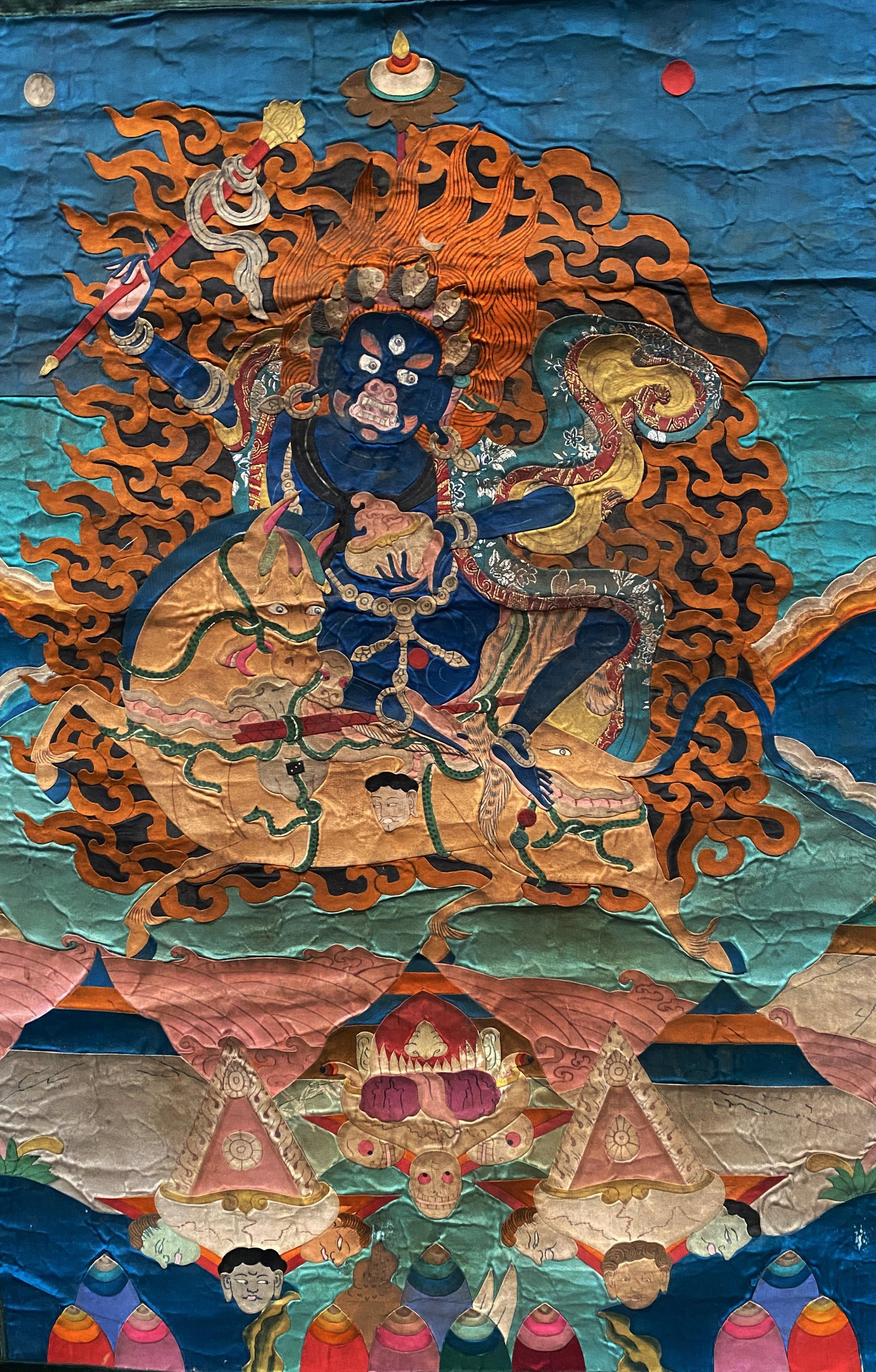 A Tibetan Appliqued Silk & Cotton Thangka of Palden Lhamo: A Tibetan Appliqued Silk & Cotton Thangka of Palden Lhamo . Provenance: Artemis Gallery. Dimensions: 41" x 26.5". Inner Dimensions: 30" x 20.5"