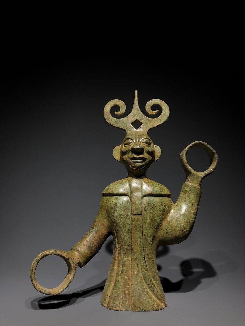 A Bronze Figure: A Bronze Figure. Dimensions: 12.20in x 4.33in x 16.54in; Weight: 22.05lbs.
