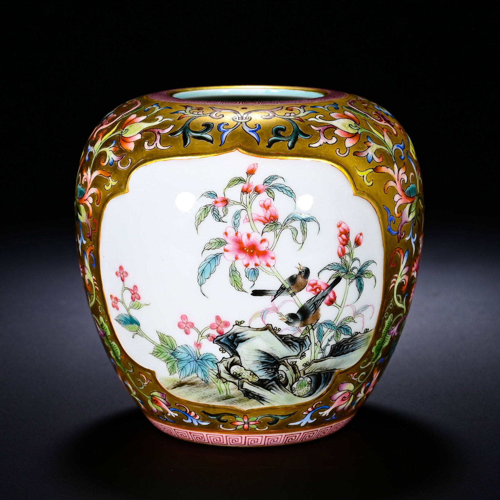 A QING DYNASTY QIANLONG PASTEL FLOWER-PATTERNED VASE WITH EMBROIDERED BRANCHES: A QING DYNASTY QIANLONG PASTEL FLOWER-PATTERNED VASE WITH EMBROIDERED BRANCHES. Height:9cm(3.54in), Diameter:9cm(3.54in)This is a Qianlong-period famille-rose jar with gilded ground, scrolling flowers