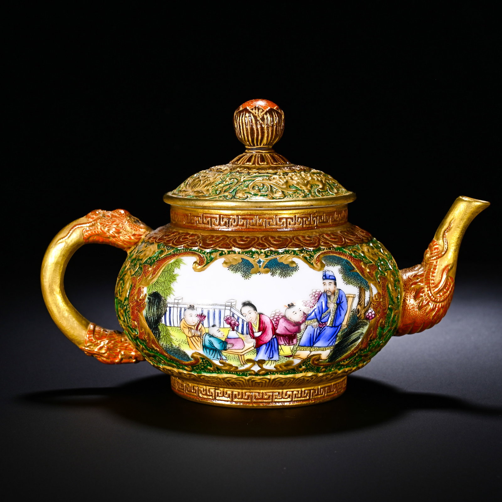 QING DYNASTY QIANLONG PASTEL CARVED FIGURES AND STORIES TEAPOT: QING DYNASTY QIANLONG PASTEL CARVED FIGURES AND STORIES TEAPOT. Height:12cm(4.72in), Width:17cm(6.69in)This is a Qianlong-period carved porcelain teapot with gilding and famille-rose reserved-panel fi