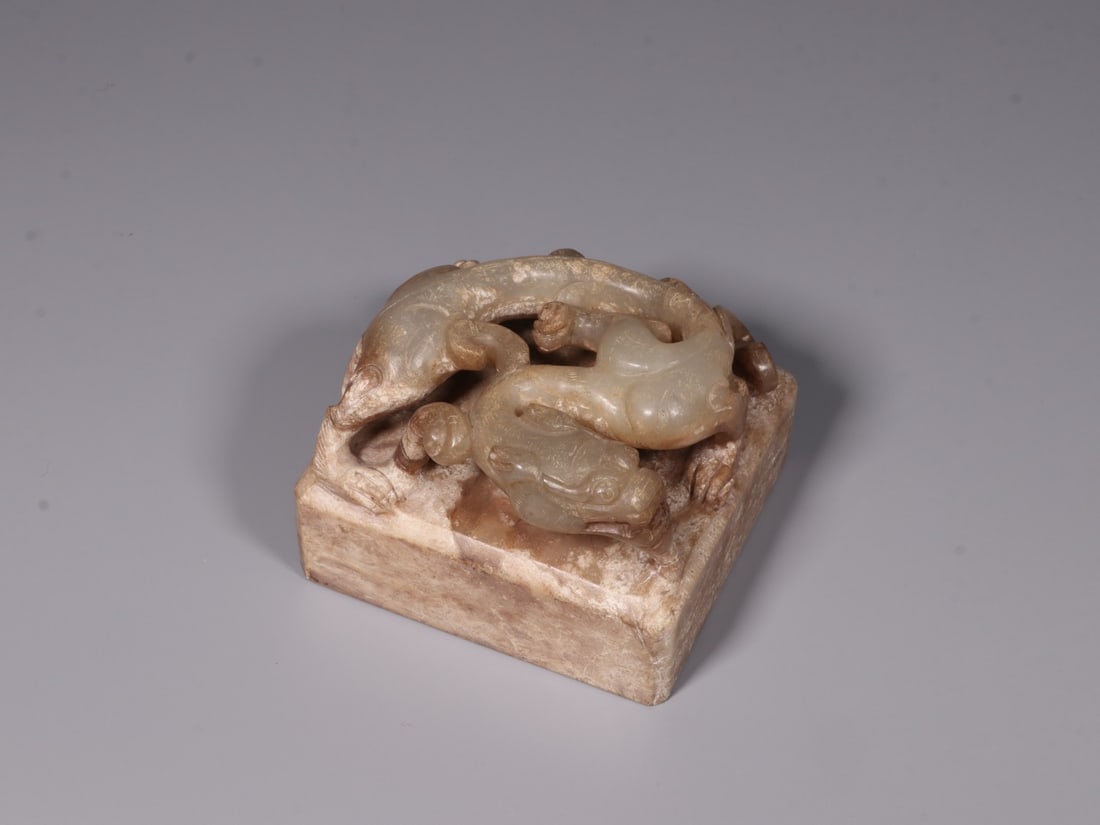 A Hetian Jade Seal: A Hetian Jade Seal. Dimensions: 2.95in x 4.02in x 3.86in; Weight: 2.69lbs.