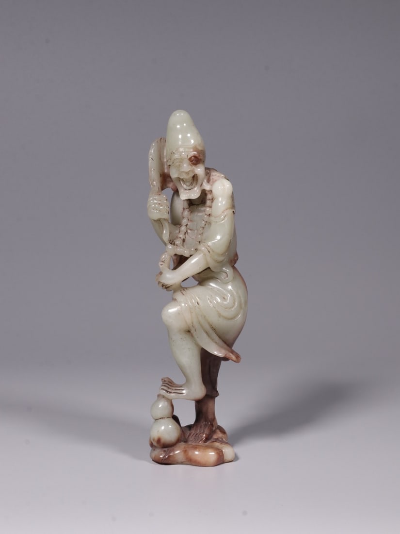 A Hetian Jade Figurine: A Hetian Jade Figurine. Dimensions: 7.87in x 2.36in x 2.17in; Weight: 1.15lbs.